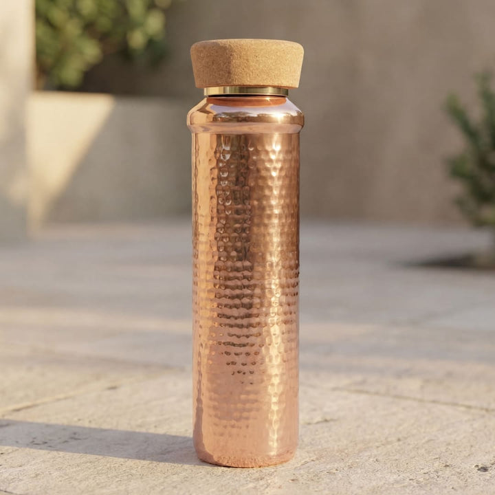 Copper water bottle with a cork lid 