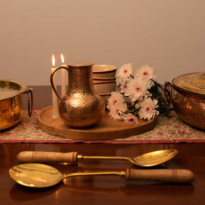 brass ladles and jug